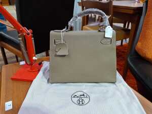 Designer-style handbag in taupe with silver-tone hardware. - 3