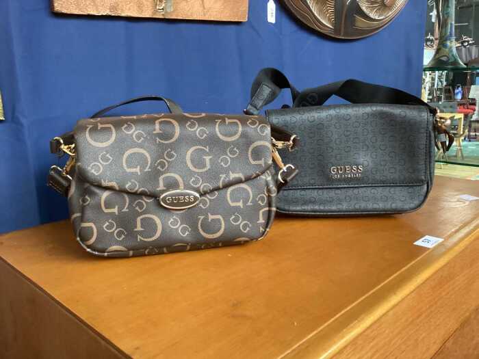 Two designer-style handbags in brown and black tones