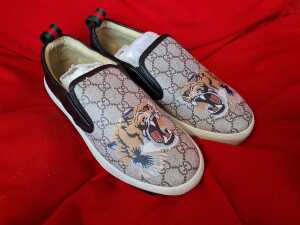 Pair of designer style slip-on canvas shoes with lion motif, size 37 - 2