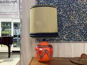 Orange lava glaze pottery lamp