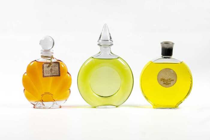 Three large factice (shop display) glass perfume bottles