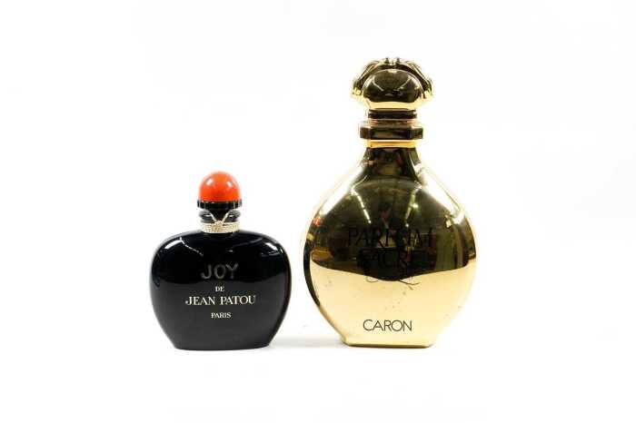 Two large factice (shop display) plastic perfume bottles