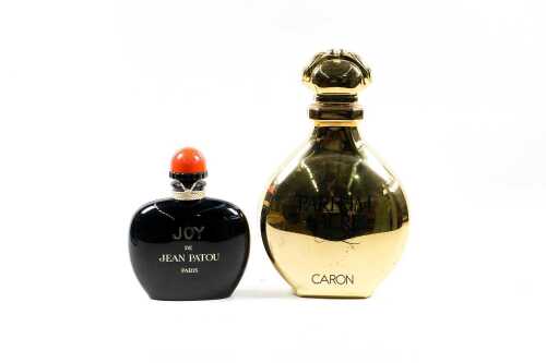 Two large factice (shop display) plastic perfume bottles