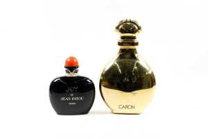 Two large factice (shop display) plastic perfume bottles