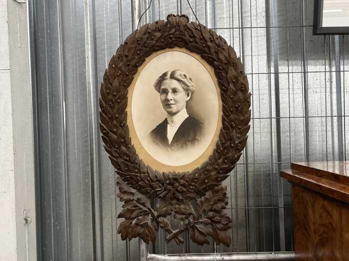 Antique carved timber laurel wreath frame with photographic portrait