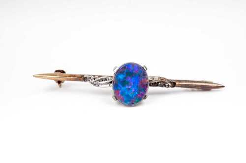 A vintage opal doublet opal brooch in 9 carat yellow and white gold
