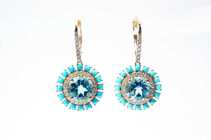 A pair of blue topaz, diamond and turquoise earrings in 14 carat yellow gold