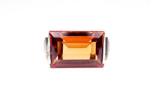 A vintage synthetic orange sapphire ring in 9 carat white gold