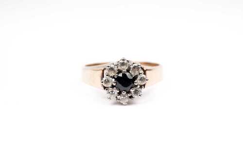 A sapphire and cubic zirconia ring in 9 carat yellow gold