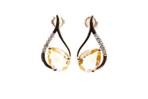 A pair of citrine and diamond earrings in 9 carat yellow gold