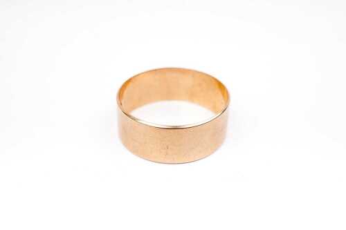 An antique wedding band in 15 carat yellow gold