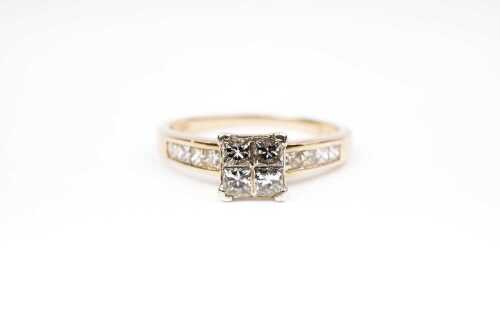 A diamond ring in 9 carat yellow gold