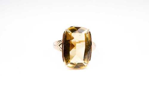 A citrine and diamond ring in 9 carat yellow gold