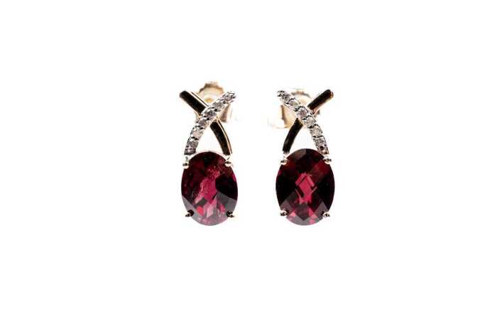 A pair of garnet and diamond earrings in 9 carat yellow gold