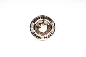 A citrine and diamond ring in 9 carat yellow gold