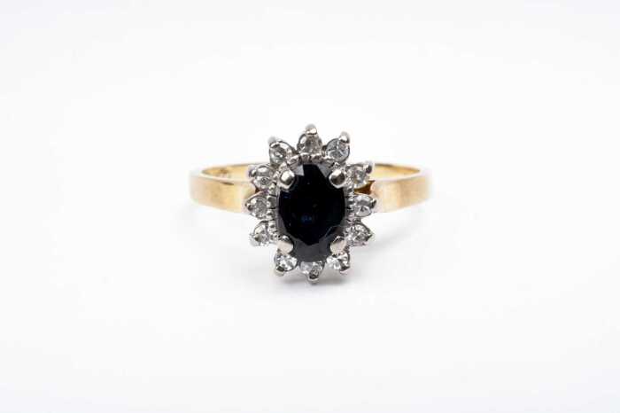 A sapphire and diamond ring in 18 carat yellow gold