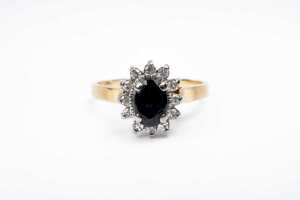 A sapphire and diamond ring in 18 carat yellow gold