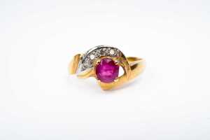 A ruby and diamond ring in 18 carat yellow gold