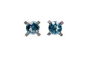 A pair of Swiss blue topaz and diamond earrings in 9 carat yellow gold