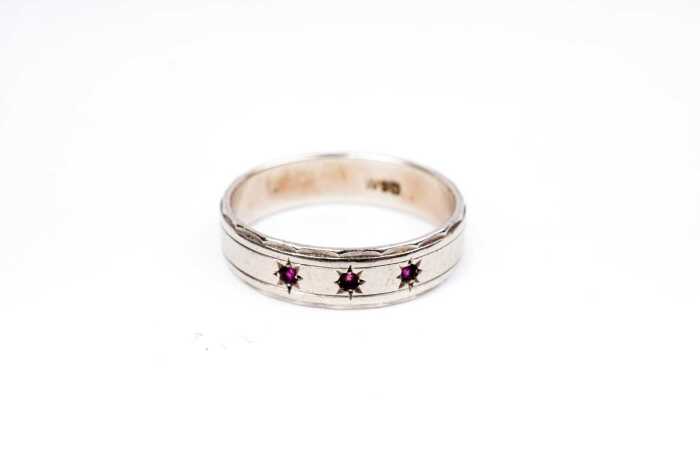 A ruby band in 9 carat white gold