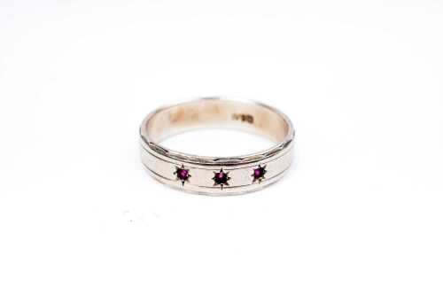 A ruby band in 9 carat white gold