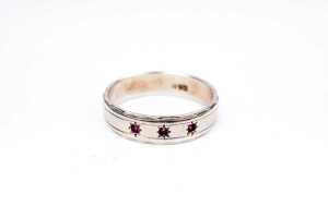 A ruby band in 9 carat white gold