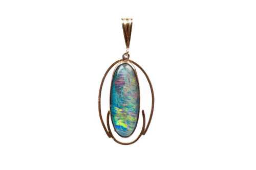 A vintage opal triplet pendant in 9 carat yellow gold