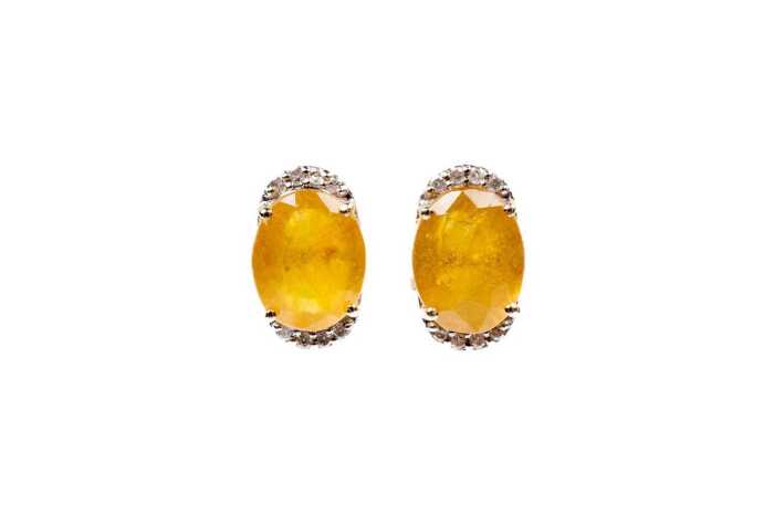 A pair of yellow sapphire and diamond earrings in 9 carat yellow gold