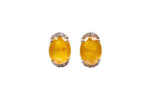 A pair of yellow sapphire and diamond earrings in 9 carat yellow gold