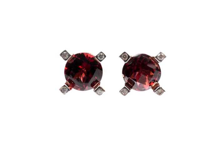 A pair of garnet and diamond earrings in 9 carat yellow gold