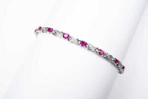 A ruby and diamond bracelet in 9 carat white gold