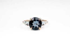 A blue topaz and diamond ring in 9 carat yellow gold