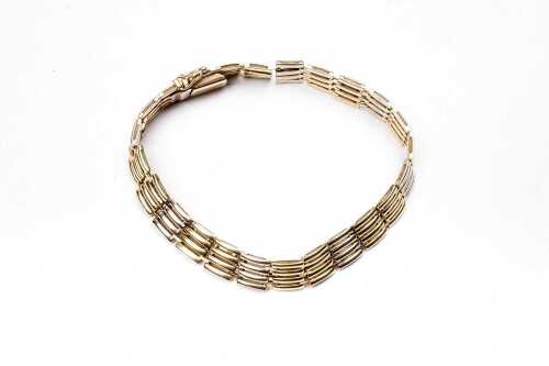 An Italian gate link bracelet in 14 carat yellow and white gold