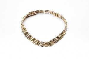 An Italian gate link bracelet in 14 carat yellow and white gold