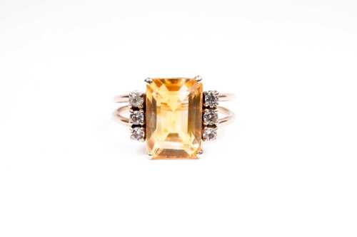 A citrine and white topaz ring in 9 carat yellow gold