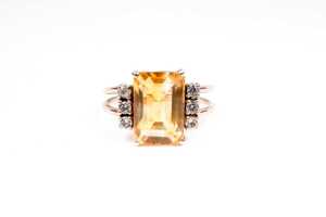 A citrine and white topaz ring in 9 carat yellow gold