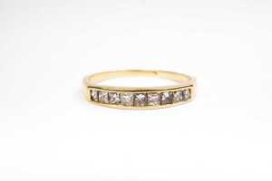 A diamond ring in 18 carat yellow gold