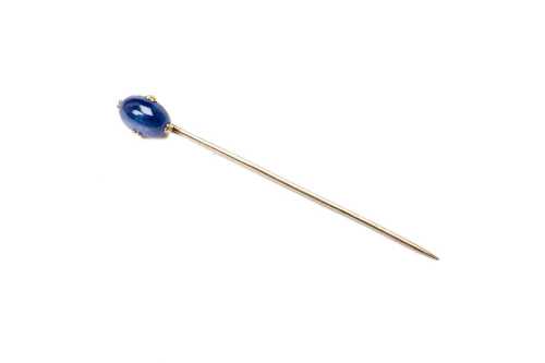 A vintage sapphire stick pin in 14 carat yellow gold