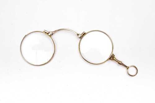 A pair of antique lorgnettes in 9 carat yellow gold