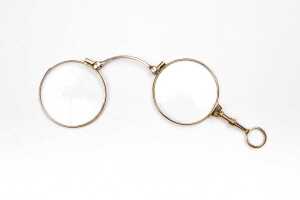 A pair of antique lorgnettes in 9 carat yellow gold