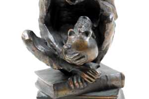 Bronzed figure of a monkey on books - 3
