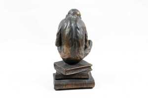 Bronzed figure of a monkey on books - 4