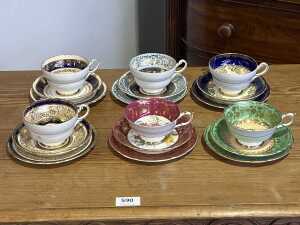 Six Paragon gilded porcelain trios