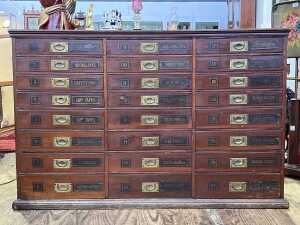 Antique draper's flight of haberdashery drawers