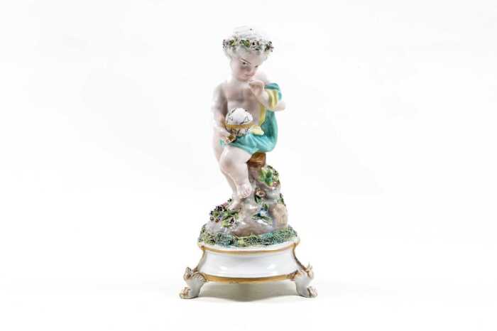 Meissen porcelain putto with globe figure