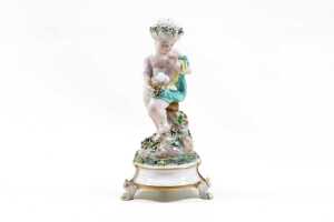 Meissen porcelain putto with globe figure