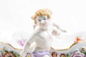 Antique Von Schierholz porcelain centerpiece bowl, with applied floral details and four cherub figures - 2
