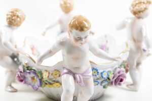Antique Von Schierholz porcelain centerpiece bowl, with applied floral details and four cherub figures - 5