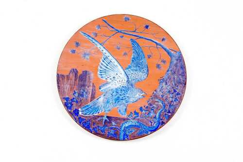Antique terra cotta wall plaque with hawk and snake decoration in blue glaze