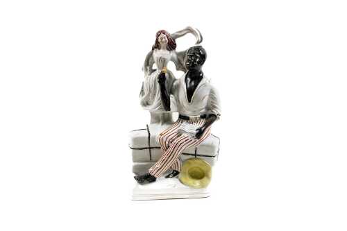 Antique Staffordshire 'Uncle Tom and Eva' ceramic figure